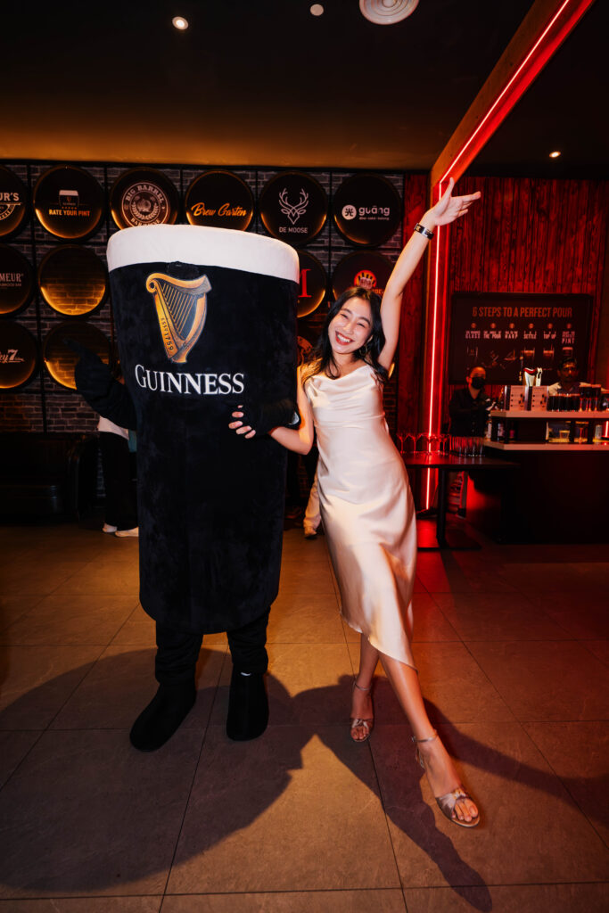 Guests engaging with Mr. Pint, the Guinness mascot, at the Guinness Perfect Pint Bar Award Night.